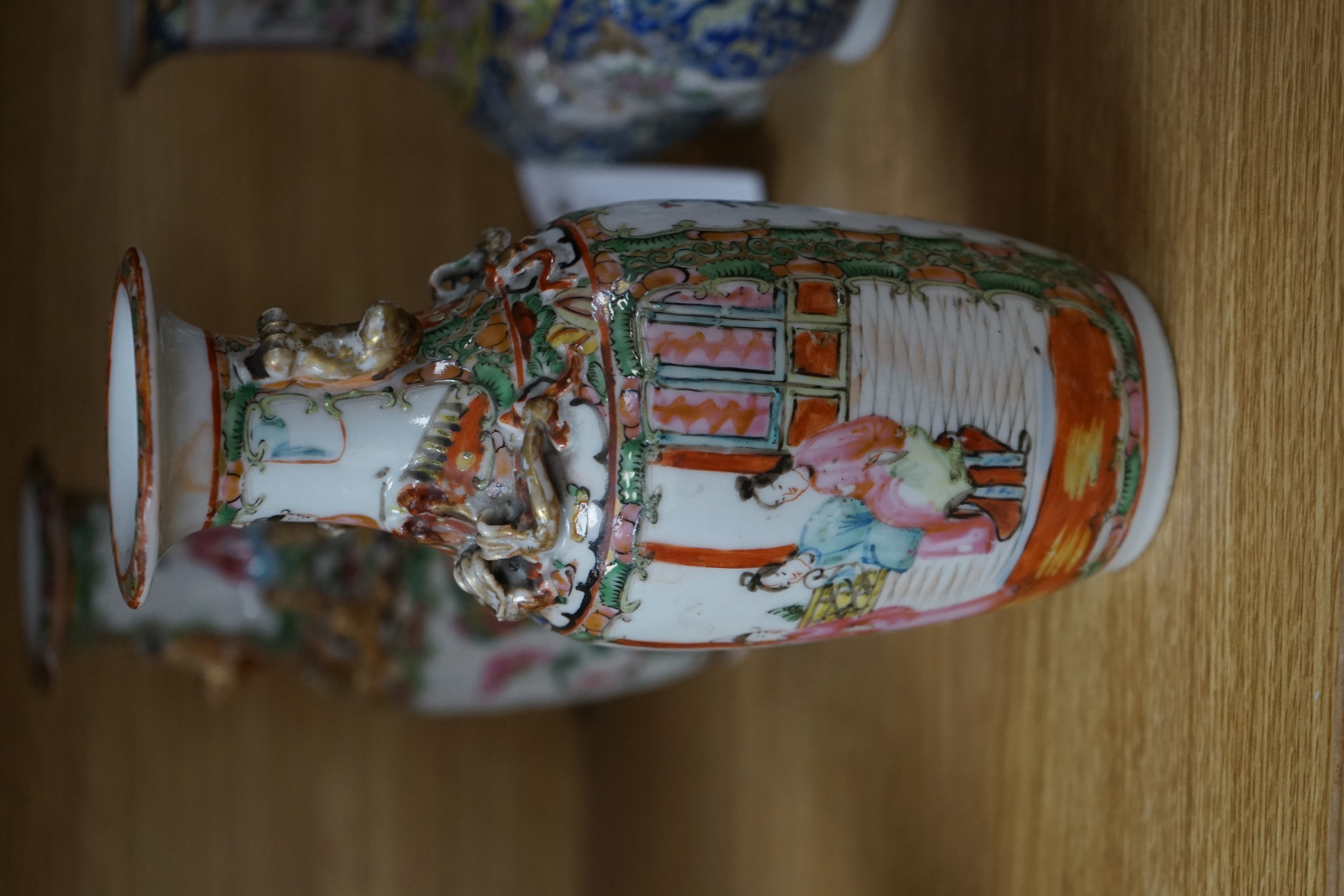 Four 19th century Chinese famille rose vases, 21cm